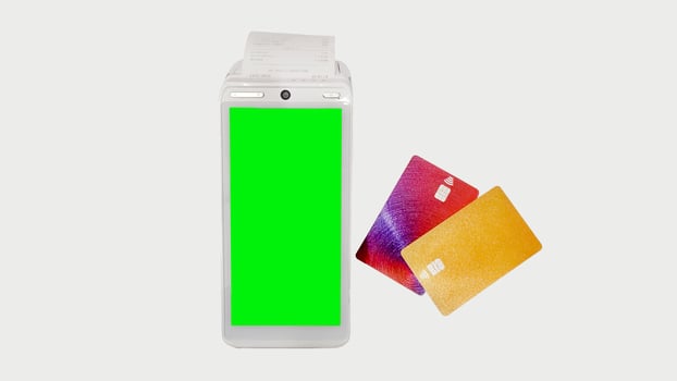 POS terminal, terminal for payment by credit and debit cards with check isolated on white background. photo