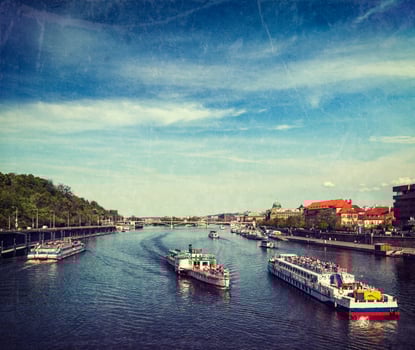 Tourist boats on Vltava river in Prague photo