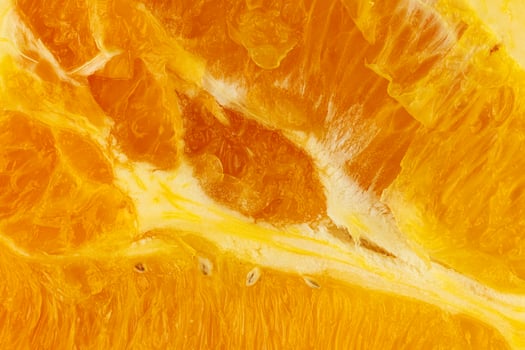 Sliced orange close-up. Slice of orange background or texture photo