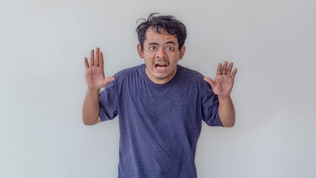 Adult male model with a surprised expression, isolated on a white background. Ideal for themes related to emotions, reactions, surprise, and unexpected events. photo