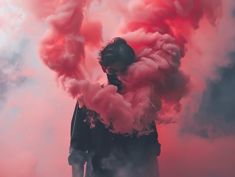 Silhouette of a person walking towards a vibrant sunrise with fog. photo