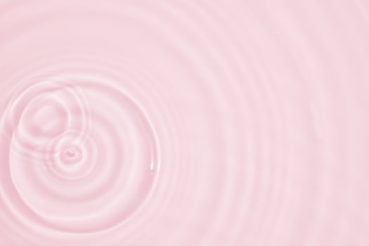 Abstract transparent water shadow surface texture natural ripple on pink background photo