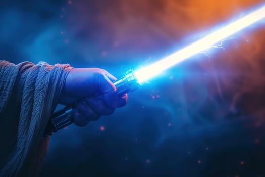 a hand holding up a light saber in front of a dark background, photo