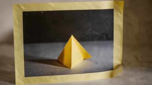 an unusual paper sculpture that is on the table, photo