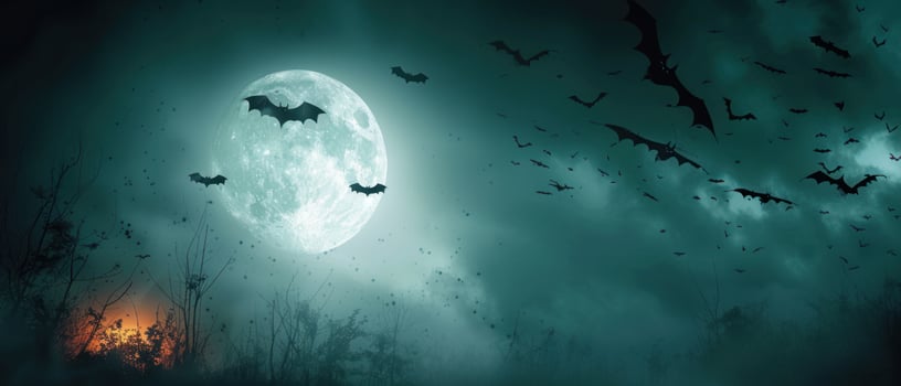 bats fly towards a full moon, photo
