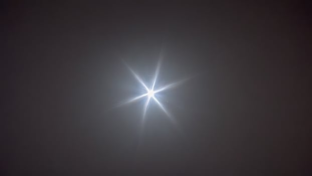 the sun shines brightly on an overcast day, photo