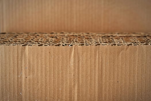 a cardboard box with some holes in it, photo