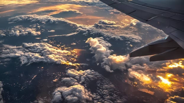 the wing and engine area of an airplane in flight, photo