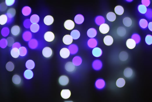 Christmas or New Year festivre blurred background with colorful garland lights photo