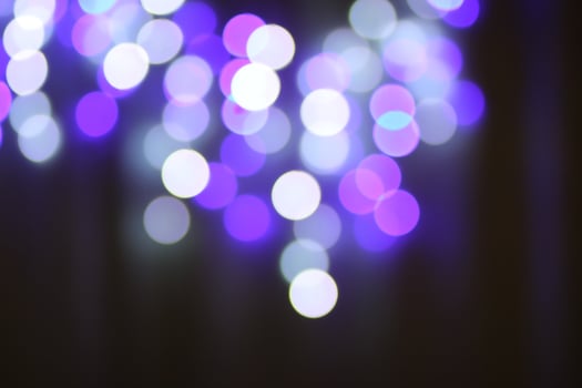 Christmas or New Year festivre blurred background with colorful garland lights photo