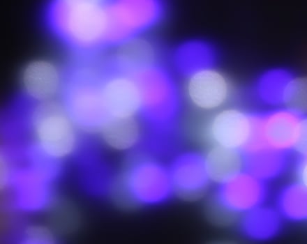Christmas or New Year festivre blurred background with colorful garland lights photo