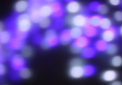 Christmas or New Year festivre blurred background with colorful garland lights photo