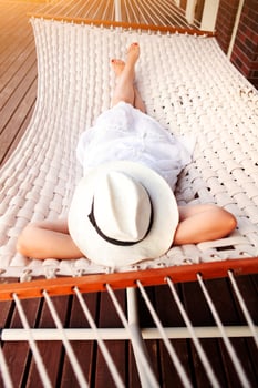 Woman lying in hammock photo