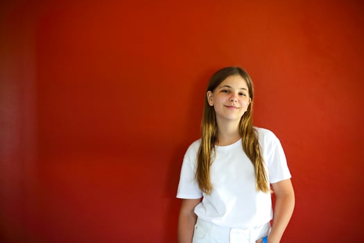 Smiling teenager looking at camera photo