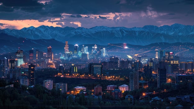 An expansive view of Almaty's cityscape at dusk with vibrant lights and mountains visible. photo