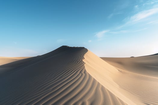 Sand Dunes Under Clear Blue Sky in Desert Landscape Background Nature photo