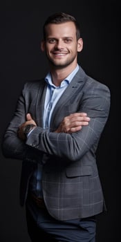 Smiling Male Executive in Minimalistic Portrait Against Dark Background photo