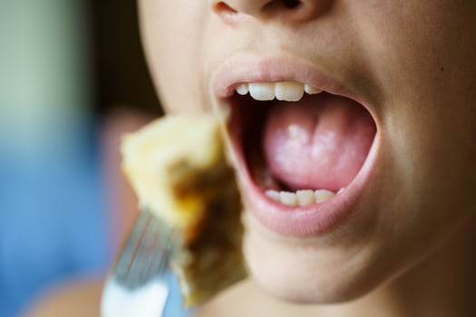 Unrecognizable girl about to eat potato omelette at home photo
