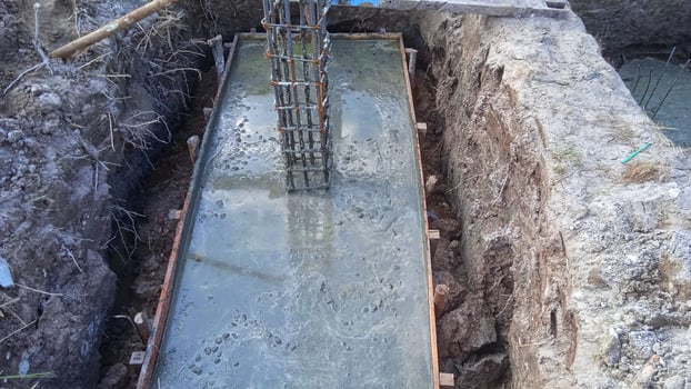 Foundation construction building site making reinforcement metal framework for pouring concrete photo