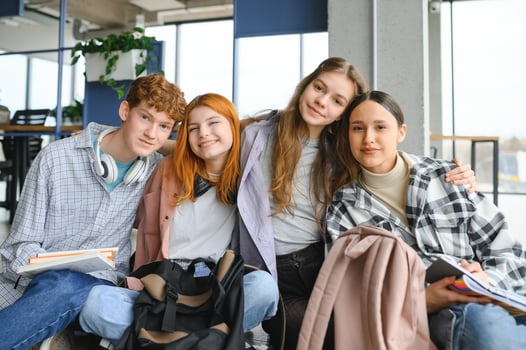 Happy high school students in the classroom photo