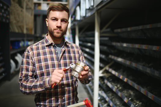 Portrait of happy mature man standing in hardware store photo