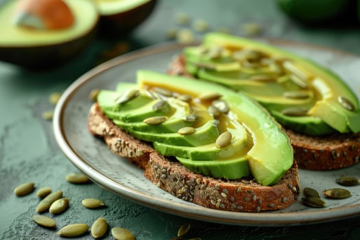 Avocado Toast for breakfast or lunch with rye bread, pumpkin seeds. Vegetarian food. photo