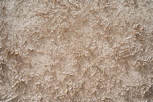 texture of antique traditional Asian clay wall with straw closeup photo