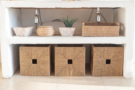 Details of modern cozy white interior with wicker boxes photo