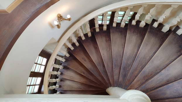 Antique brown wooden spiral staircase. photo