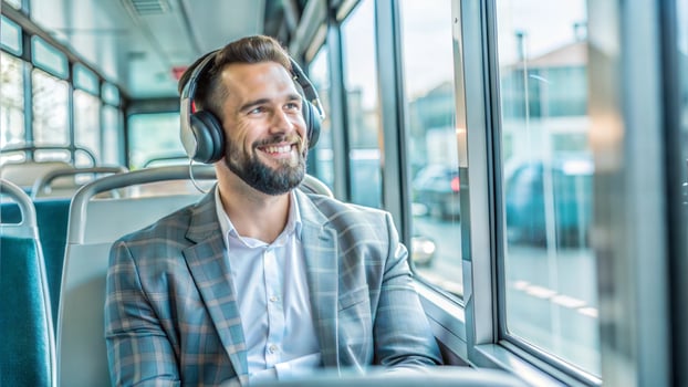 Businessman traveling by bus and listening to music with headphones on the bus photo