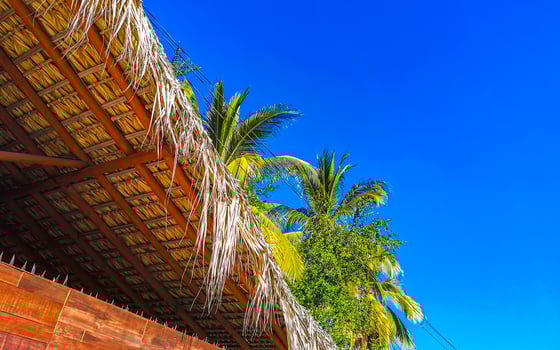 Mountain panorama cliffs rocks hilly tropical landscape building house Mexico. photo