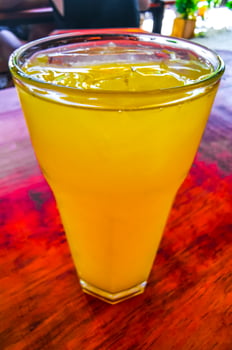 Orange fruit juice in restaurant PapaCharly Playa del Carmen Mexico. photo