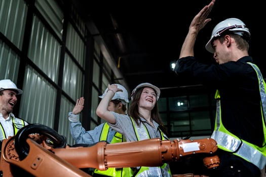 team engineers inspecting on machine with smart tablet. Worker works at heavy machine robot arm. The welding machine with a remote system in an industrial factory. Artificial intelligence concept. photo