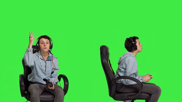 Furious displeased gamer losing games multiplayer tournament with her friends on online connection, greenscreen backdrop. Angry woman lost shooter competition, gaming setup. Camera B. photo