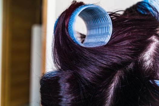 Velcro curlers on hair, natural air drying, healthy lifestyle photo