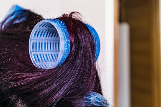 Velcro curlers on hair, natural air drying, healthy lifestyle photo