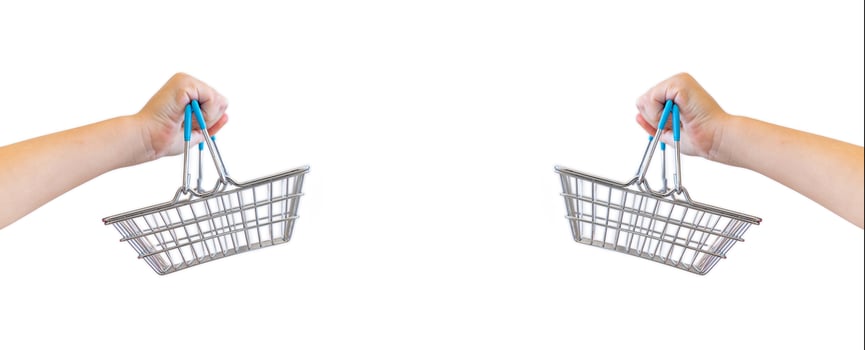 Kids hand carries Small shopping basket on white background. It is a symbol of online shopping. photo