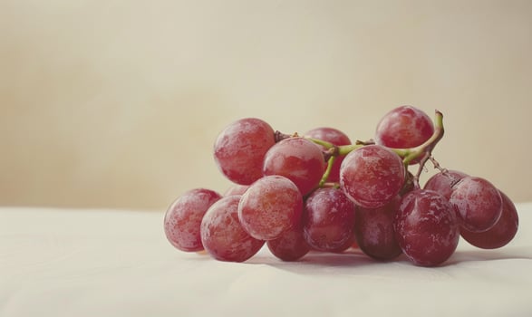 Grapes on a pastel ivory background photo