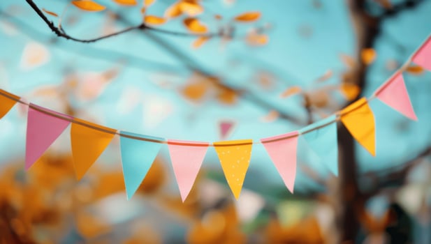 Colorful Bunting Flags Hanging in Tree photo