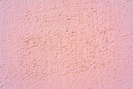 Gray stucco on wall of house. Construction industry. photo