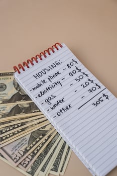 Counting receipt for utilities payment. Dollars cash money Electricity water gas price. Conservative consumption insecurity economic crisis concept. Increasing higher prices. inflation impact photo