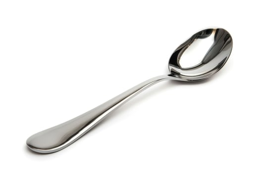 A silver metal spoon isolated on a white background. photo