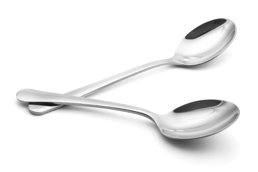 A silver metal spoon isolated on a white background. photo