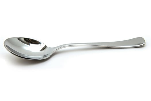 A silver metal spoon isolated on a white background. photo