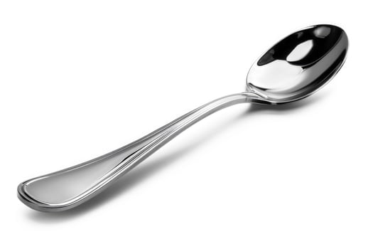 A silver metal spoon isolated on a white background. photo