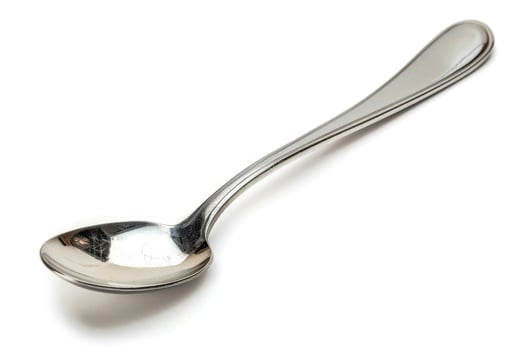 A silver metal spoon isolated on a white background. photo