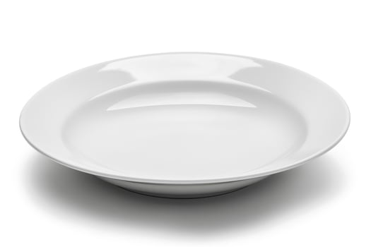 A white ceramic plate isolated on a white background. photo