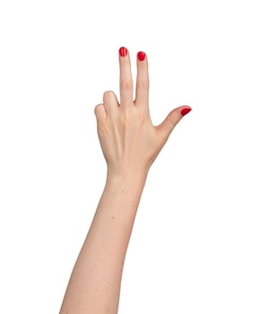 woman's hand holding up three fingers against a clean white background. The gesture, representing photo