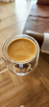 Enjoy the moment with the elegance of this coffee cup in a woman's hands. Warmth and flavor in every detail. Get this irresistible image now photo