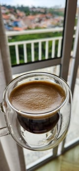 Enjoy the moment with the elegance of this coffee cup in a woman's hands. Warmth and flavor in every detail. Get this irresistible image now photo